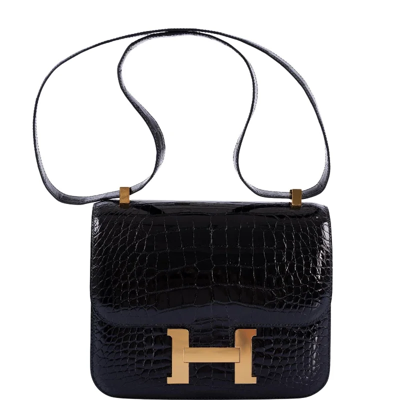 Minimalist leather handbagsHermès Constance 24 Verso Shiny Black Alligator and Rouge H with Gold Hardware