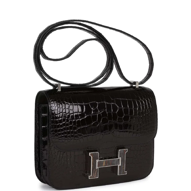 Sustainable fashion bagsHermes Constance 18 Black Shiny Alligator Palladium Tiger's Eye Hardware